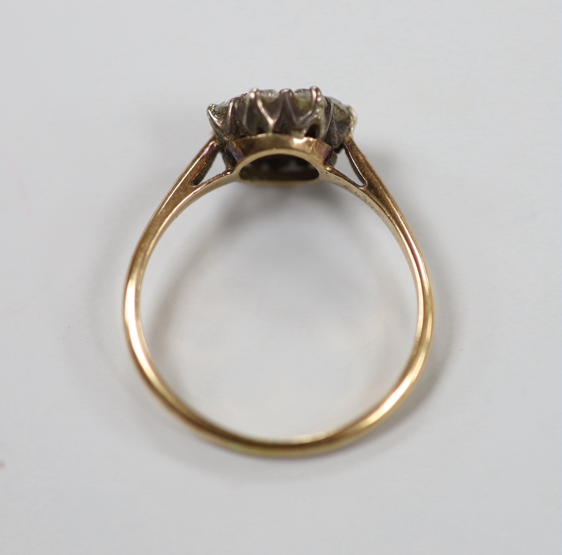 A yellow metal, sapphire and diamond set cluster ring, size N, gross weight 2.2 grams.